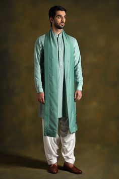 Topaz green kurta adorned with intricate diagonal placed floral embroidery on front and back and floral buttis on sleeves. Comes with white salwar and dupatta. - Aza Fashions Elegant Sherwani With Embroidered Sleeves For Eid, Elegant Eid Sherwani With Embroidered Sleeves, Designer Cotton Silk Sherwani With Traditional Drape, Unstitched Traditional Wear With Embroidered Sleeves For Wedding, Traditional Bandhgala With Embroidered Sleeves For Eid, Festive Sherwani With Embroidered Sleeves For Wedding, Traditional Wedding Sets With Embroidered Sleeves, Traditional Fitted Bandhgala With Embroidered Sleeves, Embroidered Traditional Wear For Wedding And Eid