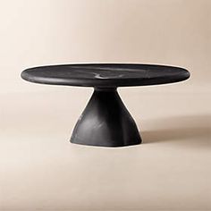 a black cake plate sitting on top of a table