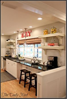 the kitchen is clean and ready to be used for breakfast or dinner time, with no one in it