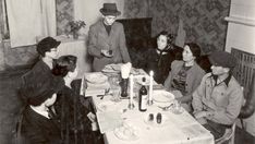 a group of people sitting around a table