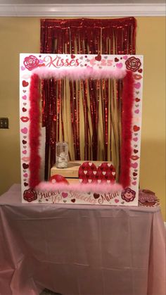 the table is decorated with red and pink decorations for valentine's day party decor