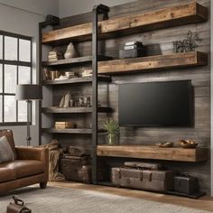 a living room filled with furniture and a flat screen tv mounted on a wooden wall