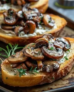 two slices of bread topped with mushrooms and cheese