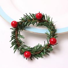 a christmas wreath is sitting on a plate