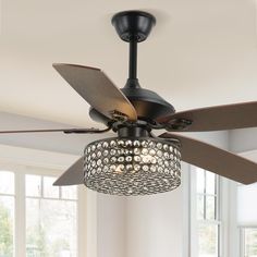 a ceiling fan with lights on it in a room