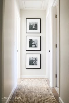 the hallway is clean and ready to be used as a place for family photos on the wall