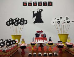 a halloween themed party with cupcakes and decorations