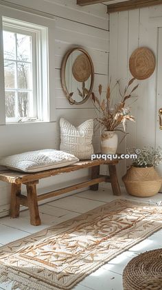 a bench sitting in the middle of a living room next to a potted plant