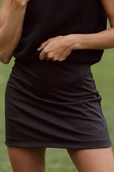 The stylish and functional Carla Skirt is designed to be slightly longer to help you look and feel your best on and off the course. This 16 inch golf skirt is made from a high-quality blend of materials, making it soft, breathable, and lightweight, ensuring you stay cool and comfortable during even the hottest rounds of golf. We take pride in knowing that our materials are not see through, try this skirt on to see what we mean! See our size chart below for more specific details. Black Fitted Functional Skort, Functional Black Fitted Skort, Fitted Athleisure Bottoms For Golf, Versatile Tennis Skirt With Built-in Shorts, Spring Fitted Go-dry Skort, Fitted Go-dry Skort For Spring, Short Sports Skirt With Lining, Sporty Lined Skort, 4-way Stretch Lined Mini Tennis Skirt