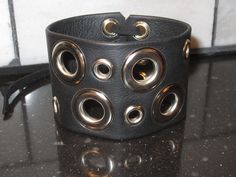 "Mens / Womens Adjustable Corset closure Leather Wrap Bracelet Black or Brown Genuine Leather Bracelet Corset Belt or REQUEST a 2 Snap closure Genuine Leather Sample shown in size 7\" ( See sizing info below) You choose any size! 2\" wide 7\" size is .. 7.5\" long.. from edge to edge when laid flat .. 7\" around inside circumference when closed. Each piece is hand made out of Genuine Leather. Patterns on the Leathers may vary slightly as each one is hand made. PLEASE Visit our shop to see more n Metal Corset, Black Leather Cuff Bracelet, Leather Patterns, Genuine Leather Bracelet, Leather Cuff Bracelet, Corset Belt, Dope Jewelry, Wrist Band, Funky Jewelry