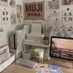 a desk with a computer, mouse and other office supplies on it in an office