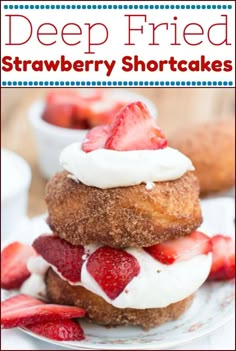 a stack of strawberry shortcakes with whipped cream and strawberries on the top