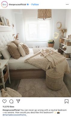 a bedroom with white walls and beige bedding in the center is decorated with wicker baskets