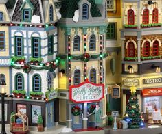 a large display of christmas themed buildings and lights