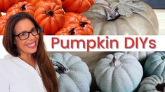 a woman standing in front of pumpkins with the words pumpkin diys on it