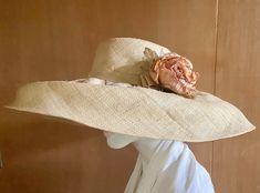 "Glamorous, well made wide brim straw hat. Natural raffia tight woven hat features a lovely mauve and apricot colored silk rose.  Unique, one of a kind couture hat with no label or maker. Perfect for sun protection and privacy - Very old time Hollywood glam reminiscent of Sophia Loren.  Kentucky Derby - Spring and Summer Weddings 21\" circumference Excellent vintage condition For more fabulous finds Please visit our boutique https://www.etsy.com/shop/chicvintageclassics" Elegant Handwoven Boater Hat, Elegant Handwoven Straw Hat With Wide Brim, Elegant Handwoven Wide Brim Straw Hat, Beige Straw Hat For Beach And Royal Ascot, Natural Straw Hat For Kentucky Derby Garden Party, Elegant Handwoven Panama Hat For Spring, Elegant Beige Handwoven Straw Hat, Vintage Straw Hat For Beach And Royal Ascot, Elegant Handwoven Hats For Spring