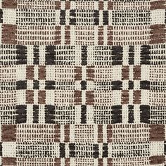 a brown and white rug with squares on it