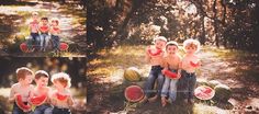 three boys are sitting on watermelon in the woods and one boy is holding a piece of watermelon