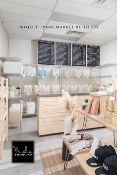 the inside of a market with many items on tables and shelves in front of them