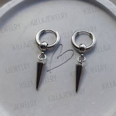 Punk/goth/ grunge style spike huggie hoop earrings in silver. Unisex. Made of 100% stainless Steel so are hypoallergenic and won't tarnish or discolour. Available as a single earring or as a pair. Also available in gold. Hoops measure 16mm  Spikes measure 18mm Comes gift wrapped 🖤  Please don't hesitate to contact me with any queries or suggestions 😊 Emo Jewelry Men, Edgy Stainless Steel Hoop Earrings, Minimalist Silver Earrings For Streetwear, Punk Style Silver Stainless Steel Hoop Earrings, Silver Stainless Steel Punk Hoop Earrings, Punk Silver Hoop Earrings For Streetwear, Punk Style Silver Hoop Earrings For Streetwear, Edgy Silver Sterling Silver Piercings, Edgy Silver Sterling Piercings