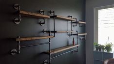 the shelves are made out of wood and metal