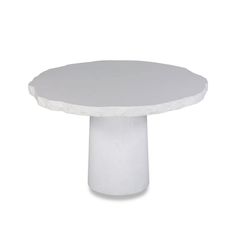 a white table with a round base on it's side, against a white background