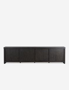 the sideboard is made from dark wood and has three doors, two drawers and one door