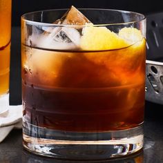 two glasses filled with drinks sitting on top of a table