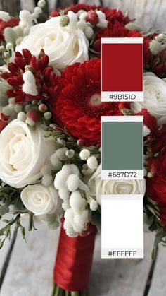 red and white flowers are in a bouquet on a wooden table with color swatches