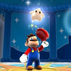 a nintendo wii game character holding a football in front of a stage with stars on it