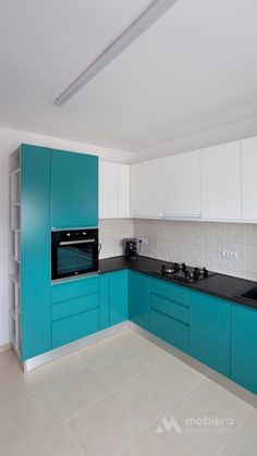 a kitchen with blue cabinets and white walls