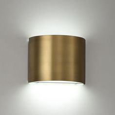 a light that is on the side of a wall with a white light behind it