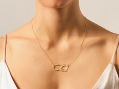 Celebrate eternal love and connection with our Infinity Name Necklace. This exquisite piece beautifully combines a timeless symbol with the personal touch of your names, creating a unique and heartfelt accessory. The pendant features the infinity symbol, elegantly intertwined with your chosen names or words, creating a meaningful and romantic design. • Material: 14k Solid Gold (Stamped 14K for authenticity) • Color Options: Yellow, Rose, White • Chain Style: Cable Chain • Chain Width: 1.10 mm • Elegant Engraved Name Necklace For Anniversary Gift, Elegant 14k Gold Name Necklace With Heart Pendant, Elegant 14k Gold Heart Pendant Name Necklace, Elegant Silver Infinity Name Necklace, Infinity Name Necklace For Anniversary, Elegant Yellow Gold Name Necklace For Anniversary, Infinity Name Necklace For Mother's Day, Personalized Infinity Necklace Elegant Style, Elegant Infinity Name Necklace For Anniversary