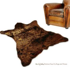 an animal skin rug is shown next to a leather chair and footstool,