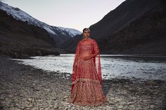 Entirely handcrafted with zardosi and crystal embroidery, this red lehenga is every bride's dream! Fabric: Microvelvet All preorders will be handled by a Nazranaa Bridal Consultant who will virtually discuss measurements and minor changes according to the client's specifications Occasion: Wedding Ceremony WASH CARE INSTRUCTIONS - Please Dry clean only when it is applicable. Slight color variation is possible due to digital photography. Jewelry not included Traditional Gown With Stone Work For Designer Wear, Heavy Red Bollywood Lehenga, Heavy Red Lehenga For Reception, Red Heavy Lehenga For Festive Occasions, Red Embellished Bollywood Lehenga, Red Embellished Lehenga For Festive Occasions, Traditional Heavy Red Dupatta, Heavy Red Dupatta With Traditional Drape, Red Wedding Lehenga With Stone Work