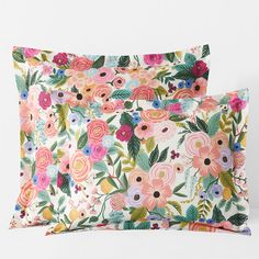 two pillow cases with colorful flowers on them