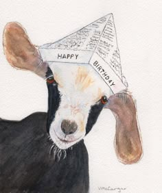 a goat with a birthday hat on it's head and the words happy written on its forehead