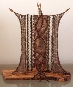 a sculpture made out of wire and wood