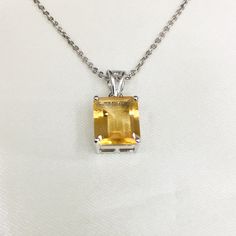 PRODUCT INFO : Stone : Natural Citrine Stone size : 10x12 mm Product Length : 2.25 Metal type : Sterling silver (92.5) Approximate weight : 2.33 grams ABOUT CITRINE GEMSTONE : CITRINES have been valued for their beauty and brilliance. They remind us of the bright, warm sun and the vitality of life. Their vibrant yellow color and shining clarity often represent a healthy mind and body as well as happiness and success. These stones evoke images of sunny warmth and illumination, and it's no surpris Octagon-shaped Citrine Jewelry For Anniversary, Octagon Shaped Citrine Jewelry For Anniversary, Octagon Citrine Jewelry For Anniversary, White Gold Jewelry With Rectangular Stone For Gift, Classic Octagon Gemstones For Gift, Classic Octagon Gemstones For Gifts, Faceted Amber Gemstones For Gift, Octagon-shaped Yellow Jewelry For Gift, Yellow Octagon-shaped Jewelry Gift