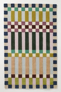 a multicolored rug with squares on it