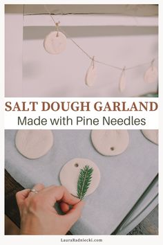 someone making pine needles out of salt dough on a sheet of paper with the words salt dough garland made with pine needles