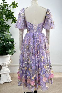 Elevate your style with our Corset Lavender Floral Embroidery Midi Dress. Featuring delicate floral embroidery and elegant puff sleeves, this piece combines femininity and sophistication. Embrace luxury in this exclusive dress. Bust and Skirt with full lining. 100% Polyester 100% Recycled polyester lining Concealed zip at center back Imported Lavender Floral Applique Dress For Spring, Spring Wedding Puff Sleeve Knee-length Dress, Spring Wedding Knee-length Puff Sleeve Dress, Fitted Lavender Embroidered Dress, Lavender Spring Dress With Sweetheart Neckline, Elegant Puff Sleeve Dresses With Floral Embroidery, Fitted Floral Embroidered Puff Sleeve Dress, Elegant Floral Embroidered Puff Sleeve Dresses, Puff Sleeve Dress With Floral Embroidery For Garden Party