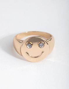 Description This cute gold-toned ring features a smiley face design with diamante details. Smiley Face Design, Face Crystals, Nose Piercings, Fashion Jewellery Online, Daisy Ring, Bold Earrings, Gold Crystal, Face Design, Rings Necklaces