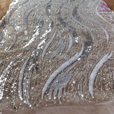 Price: The price is for 1 yard. if you buy more than 1 yard ,it won't be cut. will come in one piece the longest is 20 yards. Material: polyester,pearls,sequins,beads Fixed Wide : 125cm or 49 inches. color:off white,silver Want to see other colors and more similar Beading lace fabrics come to: https://www.etsy.com/shop/Randyfabrics?ref=hdr_shop_menu&section_id=14192305 Shipping: Choose the shipping way you need, if you want package shipped by express,please note the phone number on order. Us Elegant Silver Lace Tulle Fabric, Silver Embellished Lace Tulle Fabric, Embellished Silver Lace Tulle Fabric, Elegant Silver Lace With Sequins, Fitted Silver Lace For Party, Silver Fitted Lace Sequin Fabric, Silver Lace With Lace Work For Party, Silver Sequin Fabric With Lace For Party, Silver Sequin Fabric With Lace Work For Party