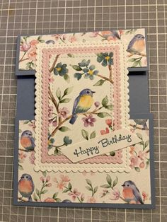 a birthday card with birds and flowers on it