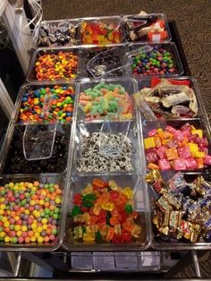 many different types of candy in plastic containers