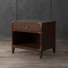 a small wooden table with two drawers on one side and an open drawer on the other