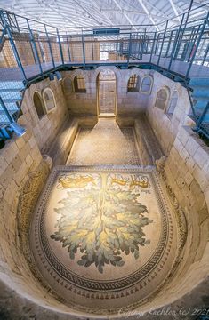 the inside of a building with an intricately designed floor