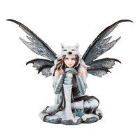 a figurine is sitting on top of a rock with an angel holding a cat