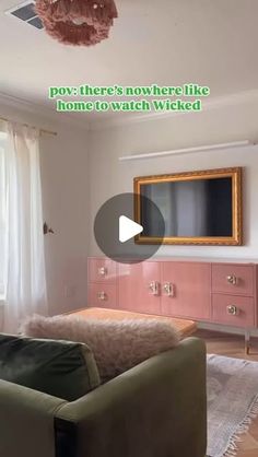 a living room filled with furniture and a flat screen tv on top of a wooden dresser